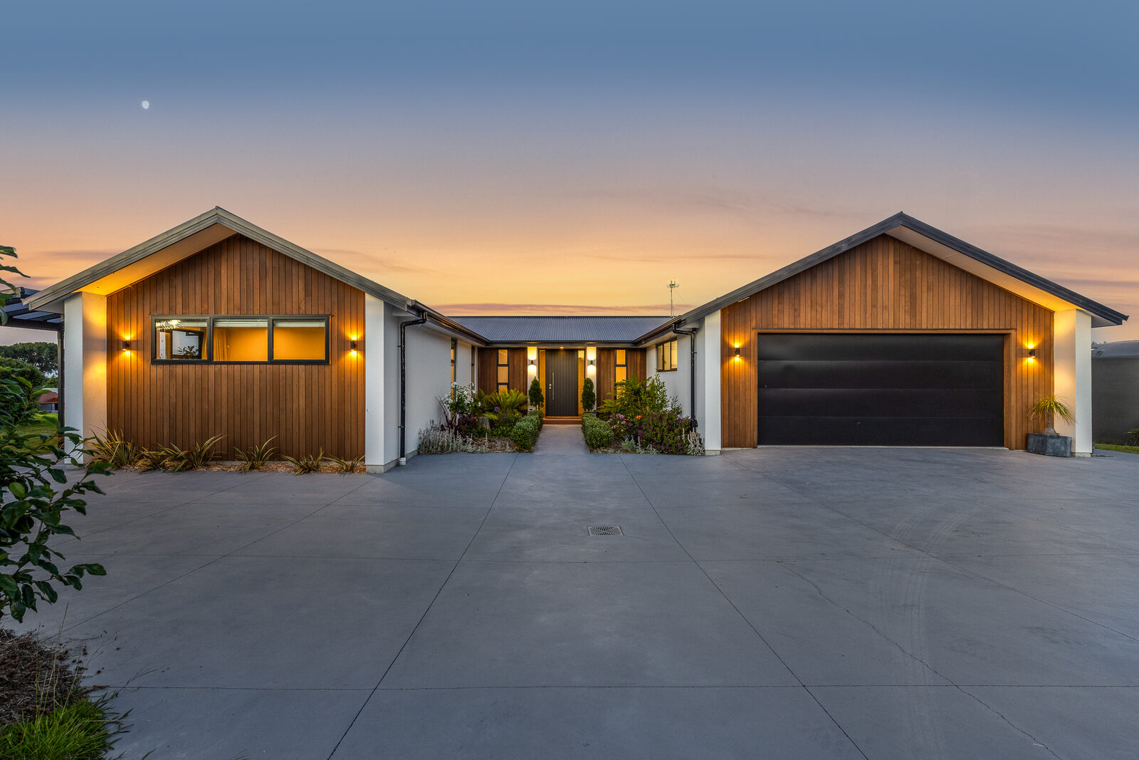 Twilight exterior, timber home with double garage