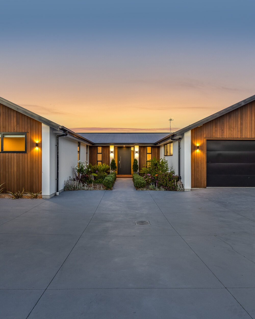 Twilight photography, homes glowing at dusk